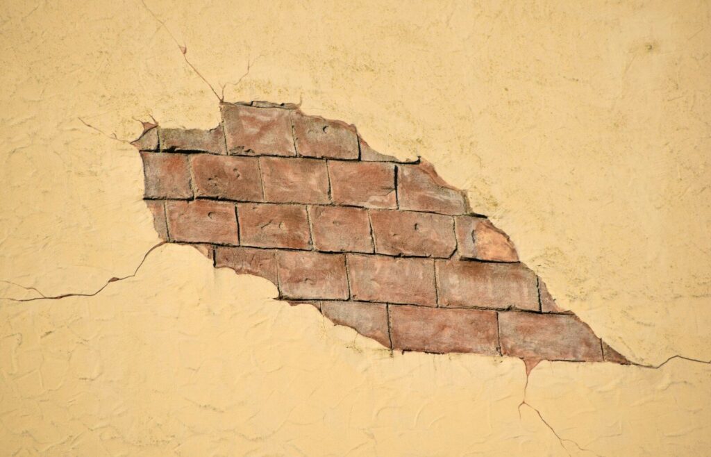 broken beige wall
