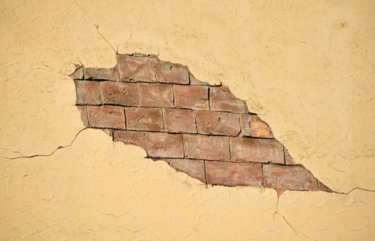 broken beige wall